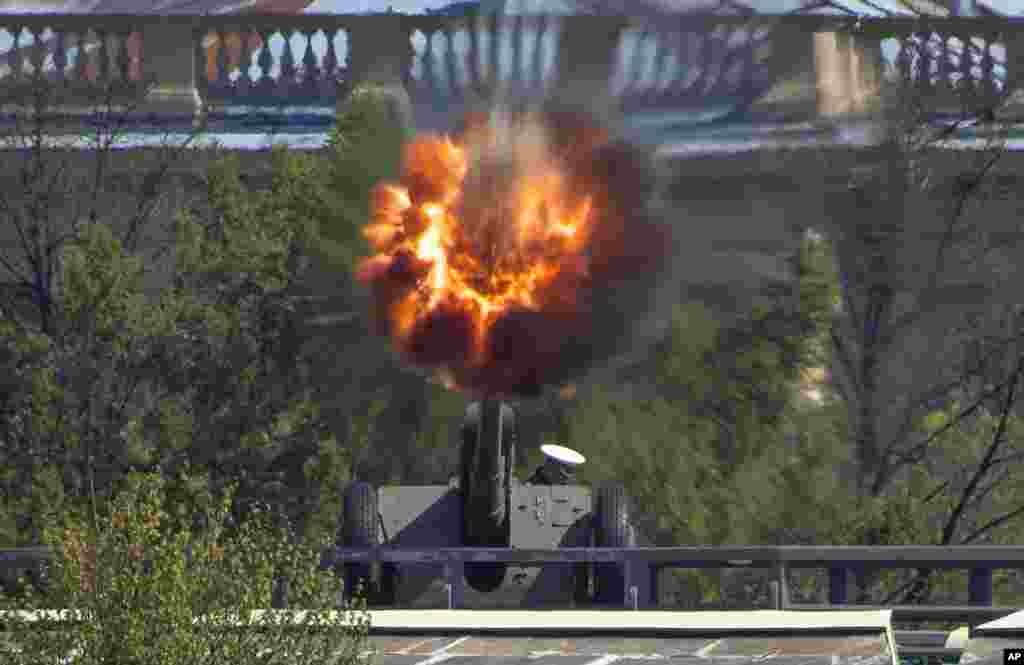 A Navy officer fires a cannon in the Saint Peter and Paul Fortress in St.Petersburg, Russia.