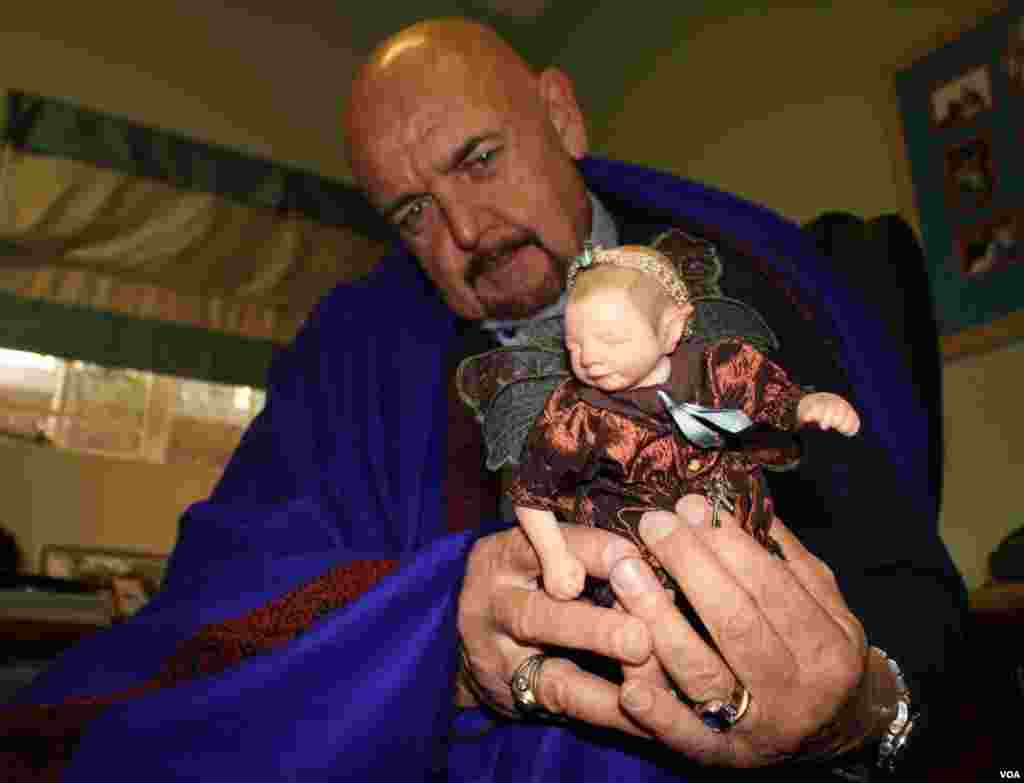 “The girls love playing with this,” Hogg says as he holds a popular fairy doll. "Children have a far stronger sense of the truth of what’s going on ... they just sense it.” (Photo by Darren Taylor) 